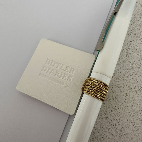 How the white pen clip looks when attached to your Diary