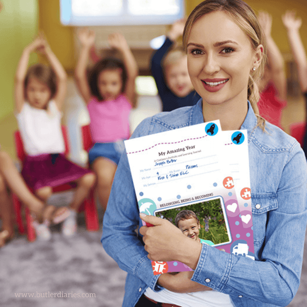 An educator holding her class' My Amazing Year Children's Learning Journals for EYLF
