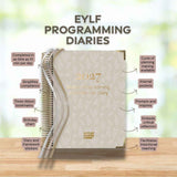 Butler Diaries 2027 Programming Diaries on a wooden surface with text highlighting features.