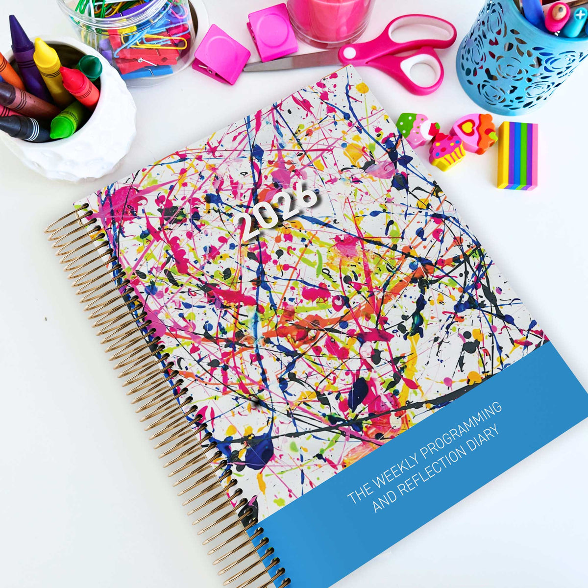 EYLF Weekly Programming and Reflection Child Educator Diary with Rainbow Falls Child Artwork Cover on an Educator's desk