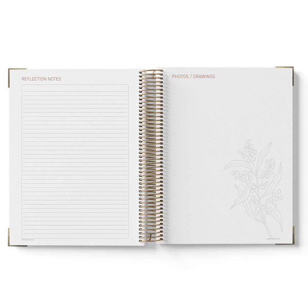 Open spiral-bound notebook with lined pages on a white background