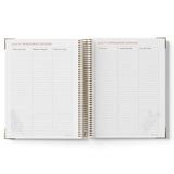 Open spiral-bound 2027 Children's Centre Diary showing a quality improvement overview section on white background