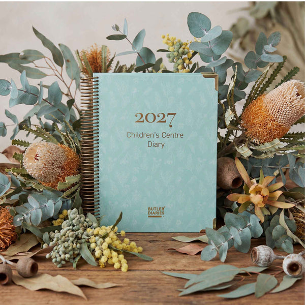 2027 Children's Centre Diary on a wooden surface with floral decorations