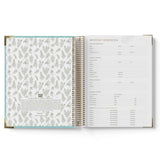 Open 2027 Children's Centre Diary showing a floral patterned cover and a page with text on a white background