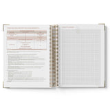 Open spiral-bound 2027 Children's Centre Diary with text and grid pages on a white background