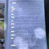 Programming notes page in Educator Planner with handwritten notes on a wooden surface