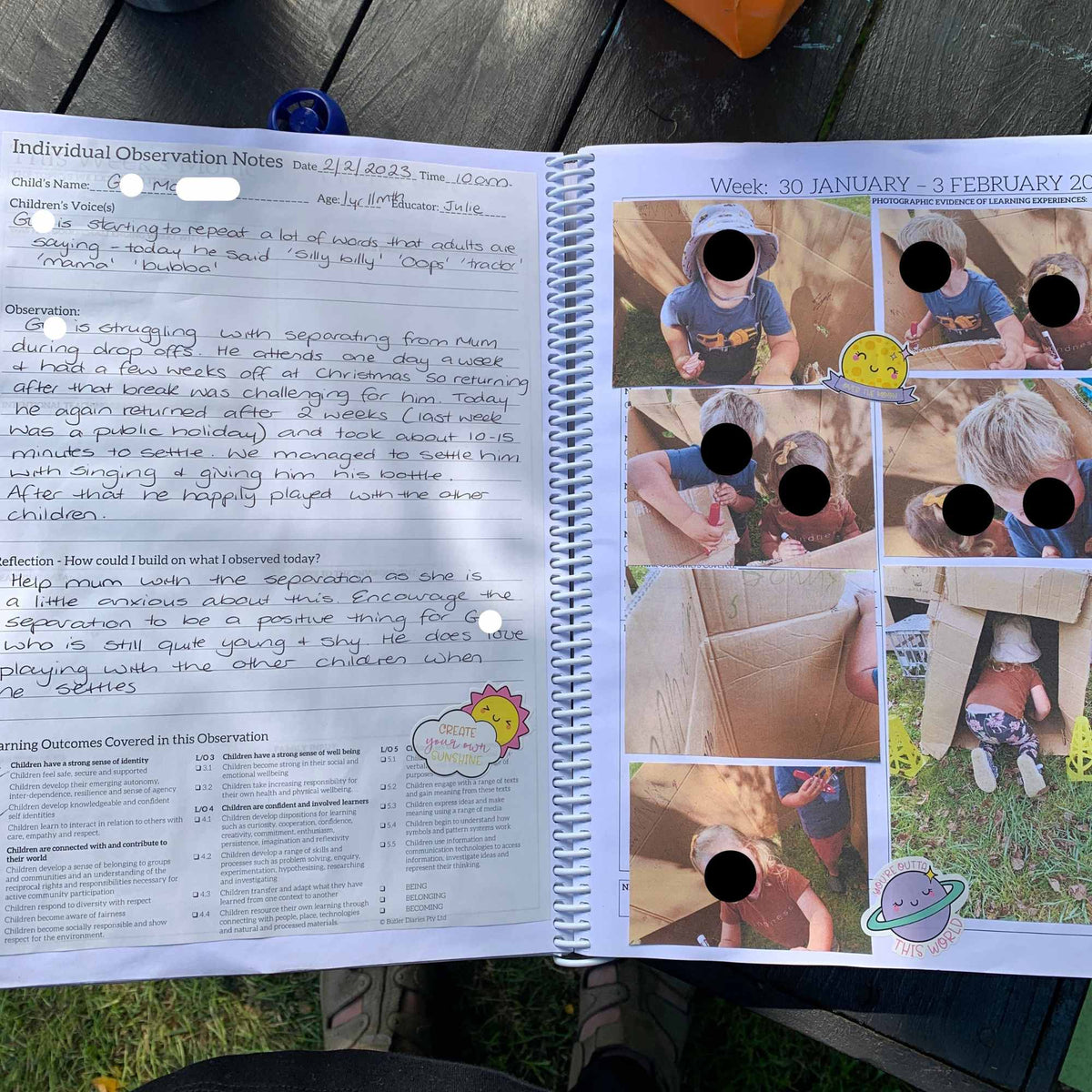 Open Educator Planner with photo collage and text on a wooden surface