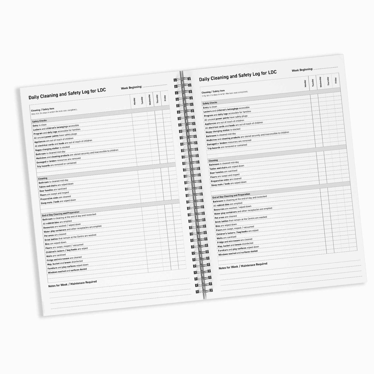 Open spiral-bound notebook with daily cleaning and safety log for LDC on a white background