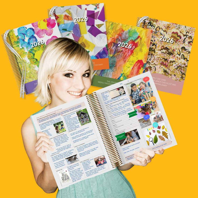 Woman holding an open planner with colorful 2026 calendars in the background