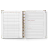 Open spiral-bound ECEC Cook Diary with lined pages on a white background