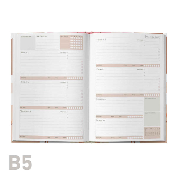 Open educator planner with B5 size label on a white background