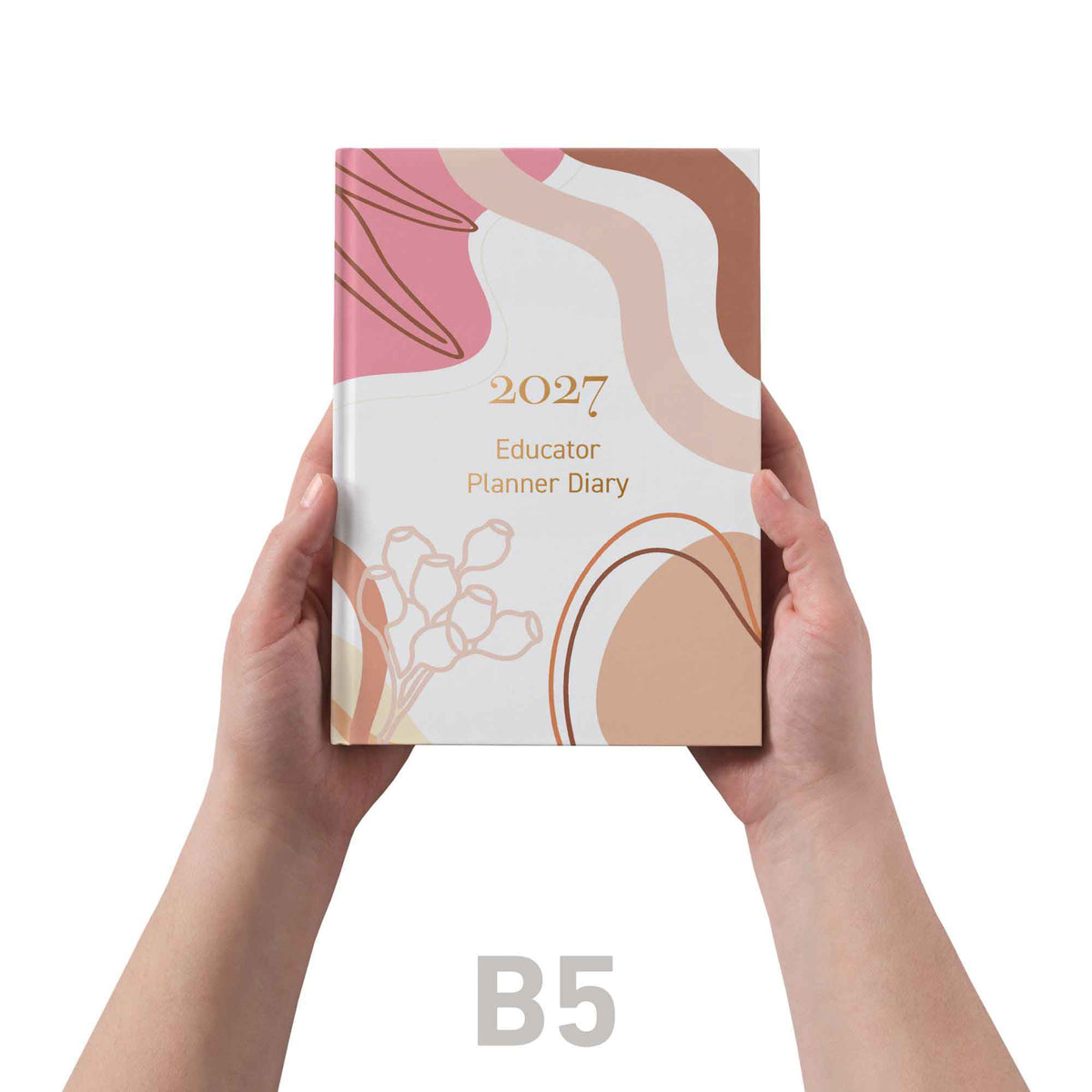 2027 Educator Planner Diary held by hands on a white background