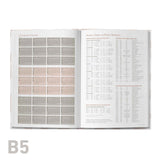 Open book showing a calendar and text on a white background