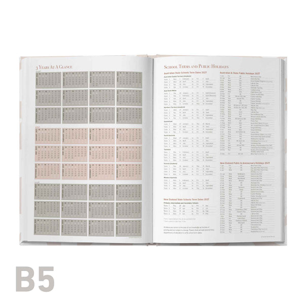 Open book showing a calendar and text on a white background