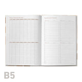 Open educator planner showing detailed weekly and monthly schedules on a white background