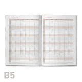 Open educator planner with monthly calendar layout on a white background