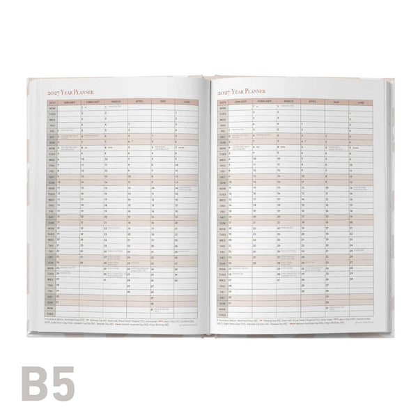 Open educator planner with monthly calendar layout on a white background