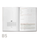 Open professional development log book with text on a white background