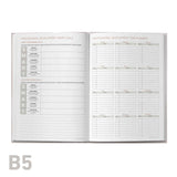 Open professional development log book with professional development sections on a white background