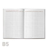Open professional development log book with grid pages on a white background