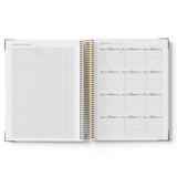Open spiral-bound 2027 Educational Leader Diary with grid and list pages on a white background
