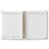Open spiral-bound 2027 Educational Leader Diary showing pages titled 'Communication Register' and 'Professional Development Summary'.
