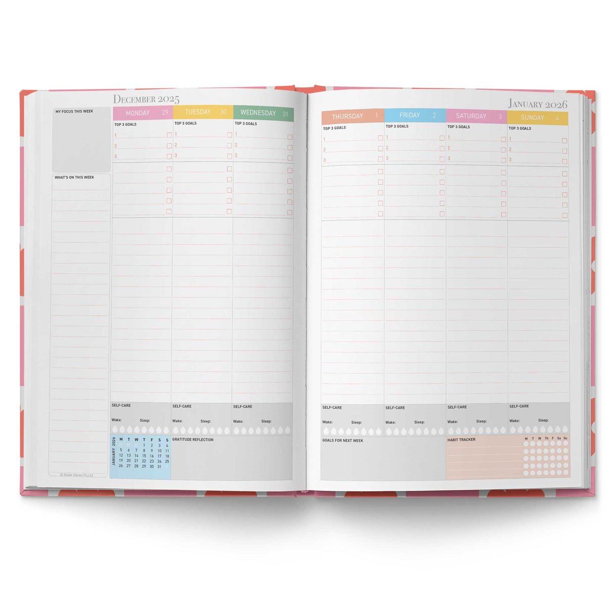 Open planner showing monthly layout with colorful headers on a white background