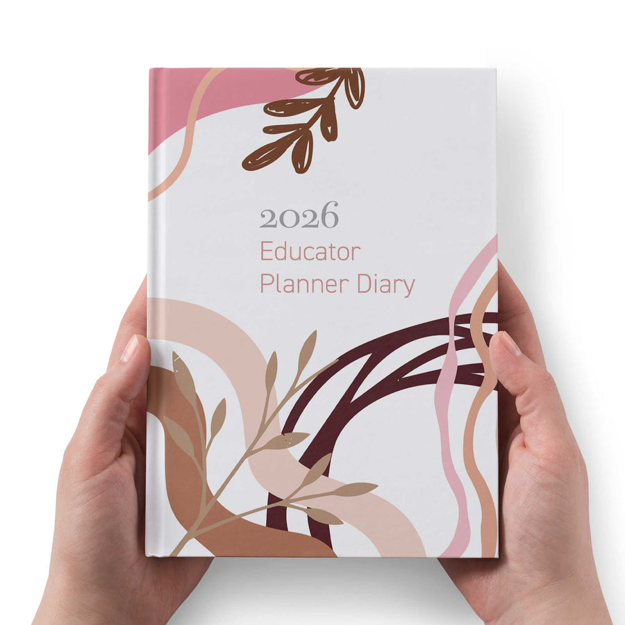 2026 Educator Planner Diary held by hands with a decorative cover on a white background