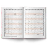 Open planner with monthly calendar layout on white background
