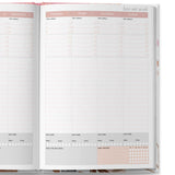Open planner showing January 2026 schedule with self-care and habit tracker sections.