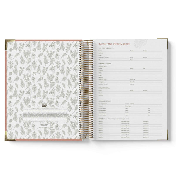 Open spiral-bound planner with floral pattern on left page and text on right page.
