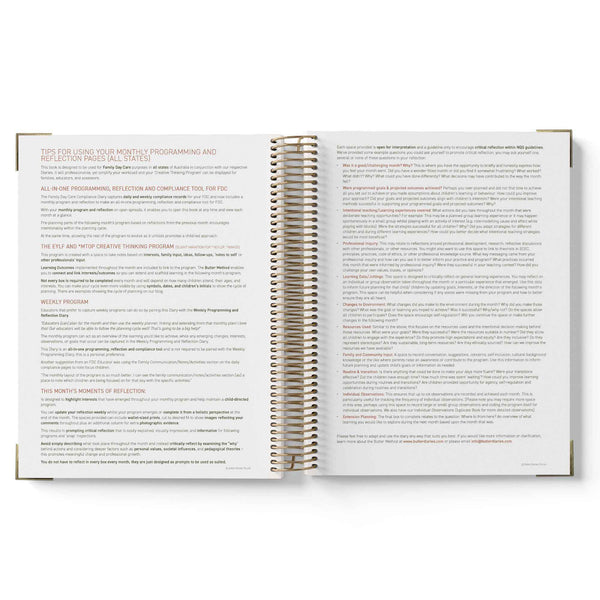 Open spiral-bound book with text on a white background