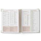Open spiral-bound 2027 Family Day Care Checklist Diary with printed content on a white background