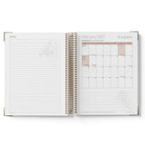 Open spiral-bound 2027 Family Day Care Checklist Diary showing notes section and February 2027 calendar on a white background