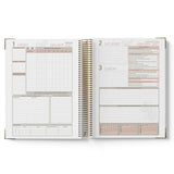 Open 2027 OSHC Diary showing a weekly layout with dates and time slots on each page.