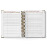 Open spiral-bound 2027 OSHC Diary with grid pages on a white background