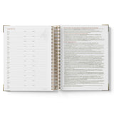 Open spiral-bound notebook showing pages with text on a white background