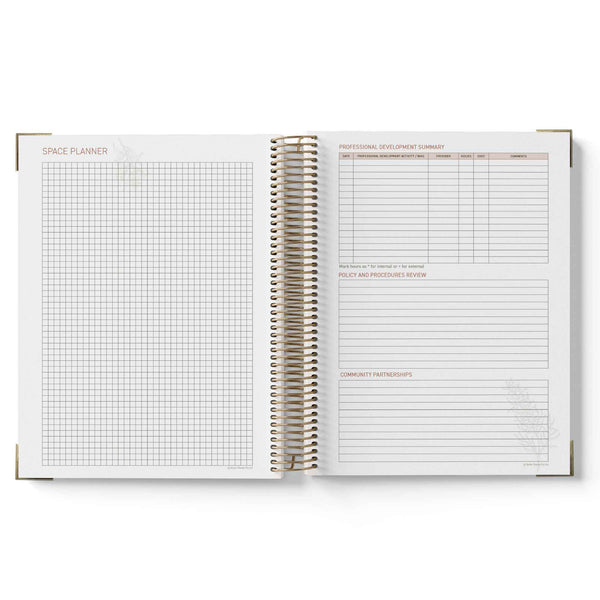 Open spiral-bound QLD Kindy Programming Diary with grid and lined pages on a white background