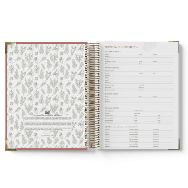 Open spiral-bound QLD Kindy Programming Diary with floral pattern on left page and text on right page.