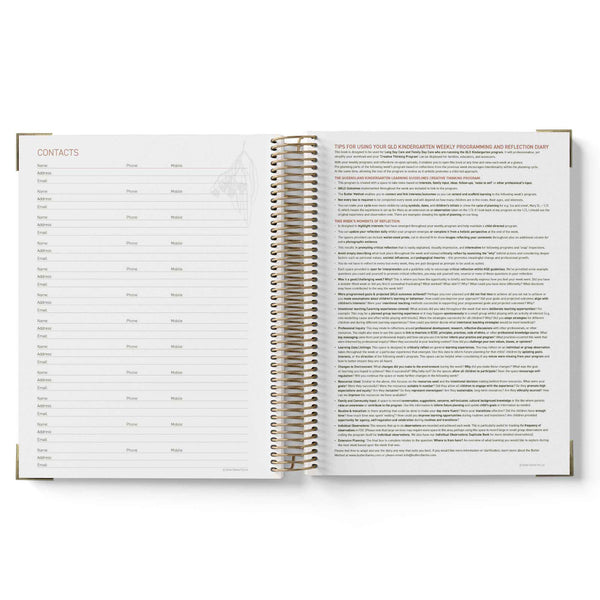 Open spiral-bound QLD Kindy Programming Diary showing pages with text on a white background