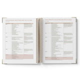 Open QLD Kindy diary with spiral binding on a white background
