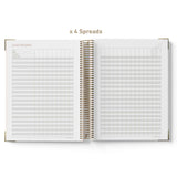 Open spiral-bound teacher planner showing grid and list-style pages on a white background