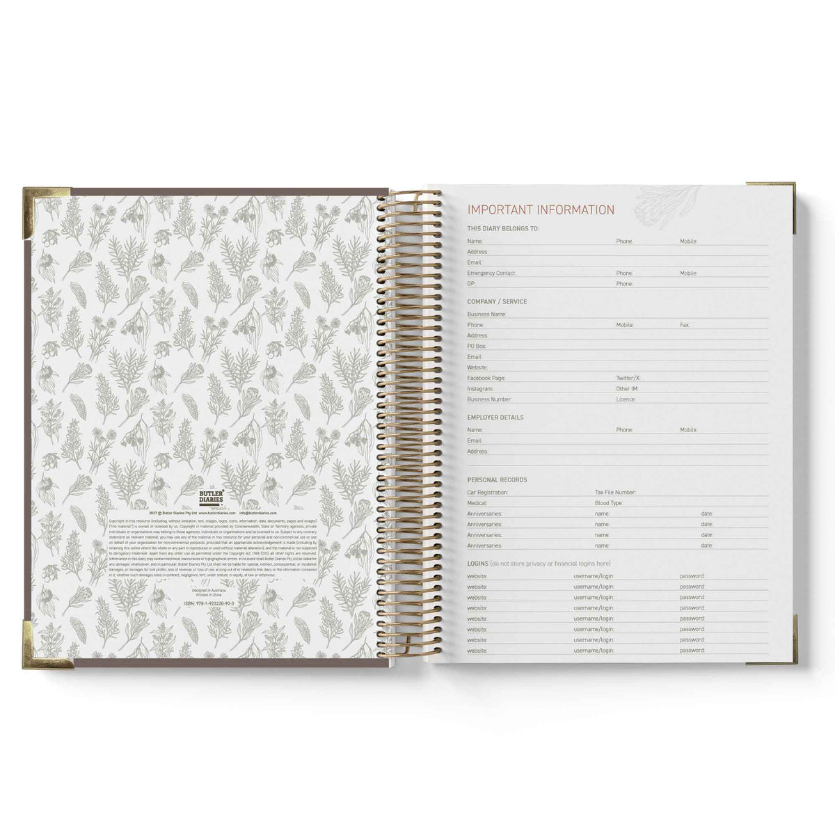 Open spiral-bound book with floral pattern on one page and text on the other, on a white background.
