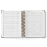 Open spiral-bound 2027 ECEC Programming Diary with grid and list pages on a white background