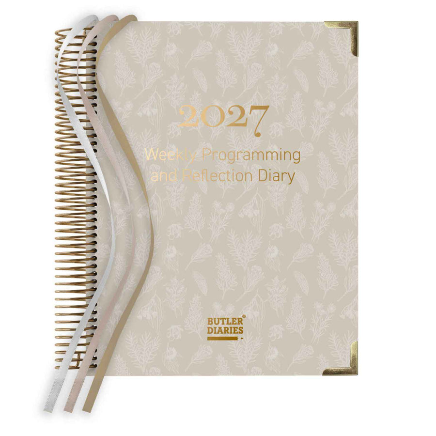 2027 weekly programming and reflection diary with beige cover and gold text on a white background